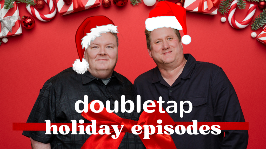 Steven and Shaun wear Santa hats and smile at the camera with the words Double Tap Holiday Episodes around them covered in tinsel