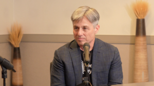 Be My Eyes CEO Mike Buckley sits in front of a microphone
